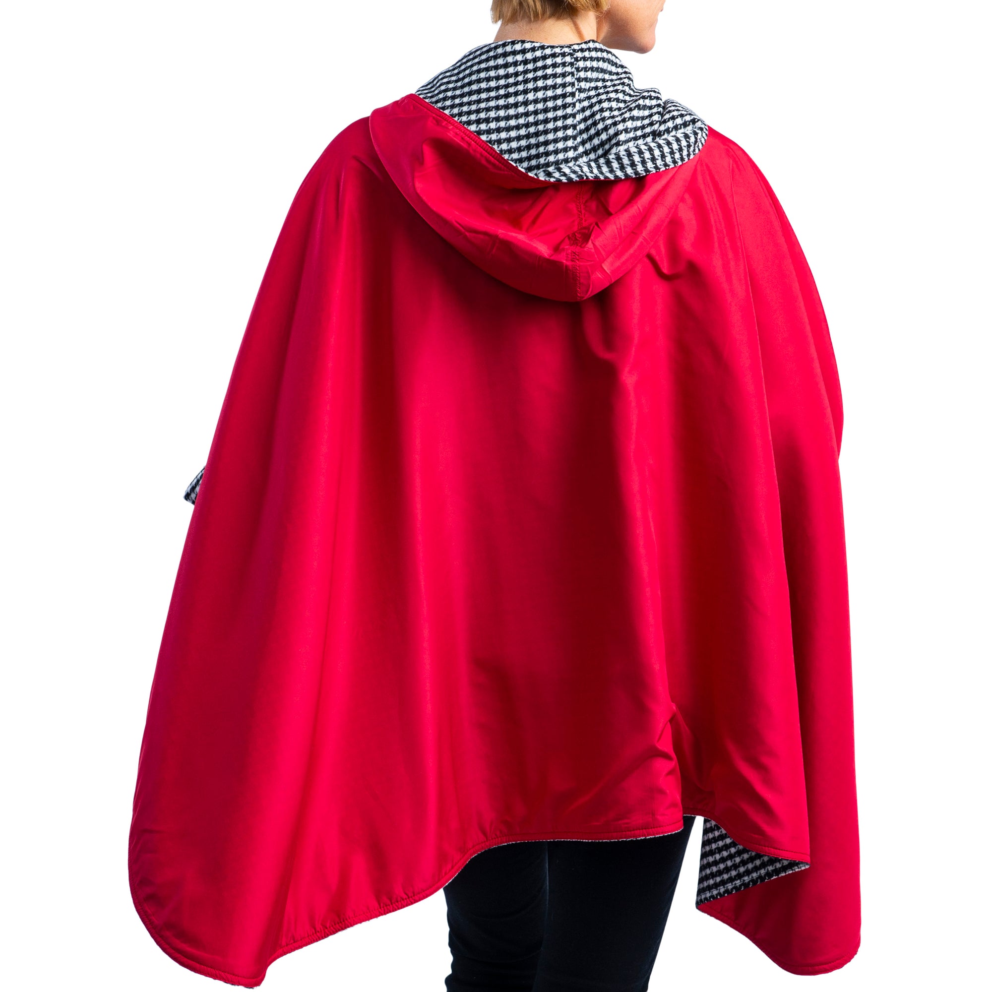 Woman wearing a WarmCaper Warm Houndstooth/Crimson Rainproof and travel cape by RainCaper