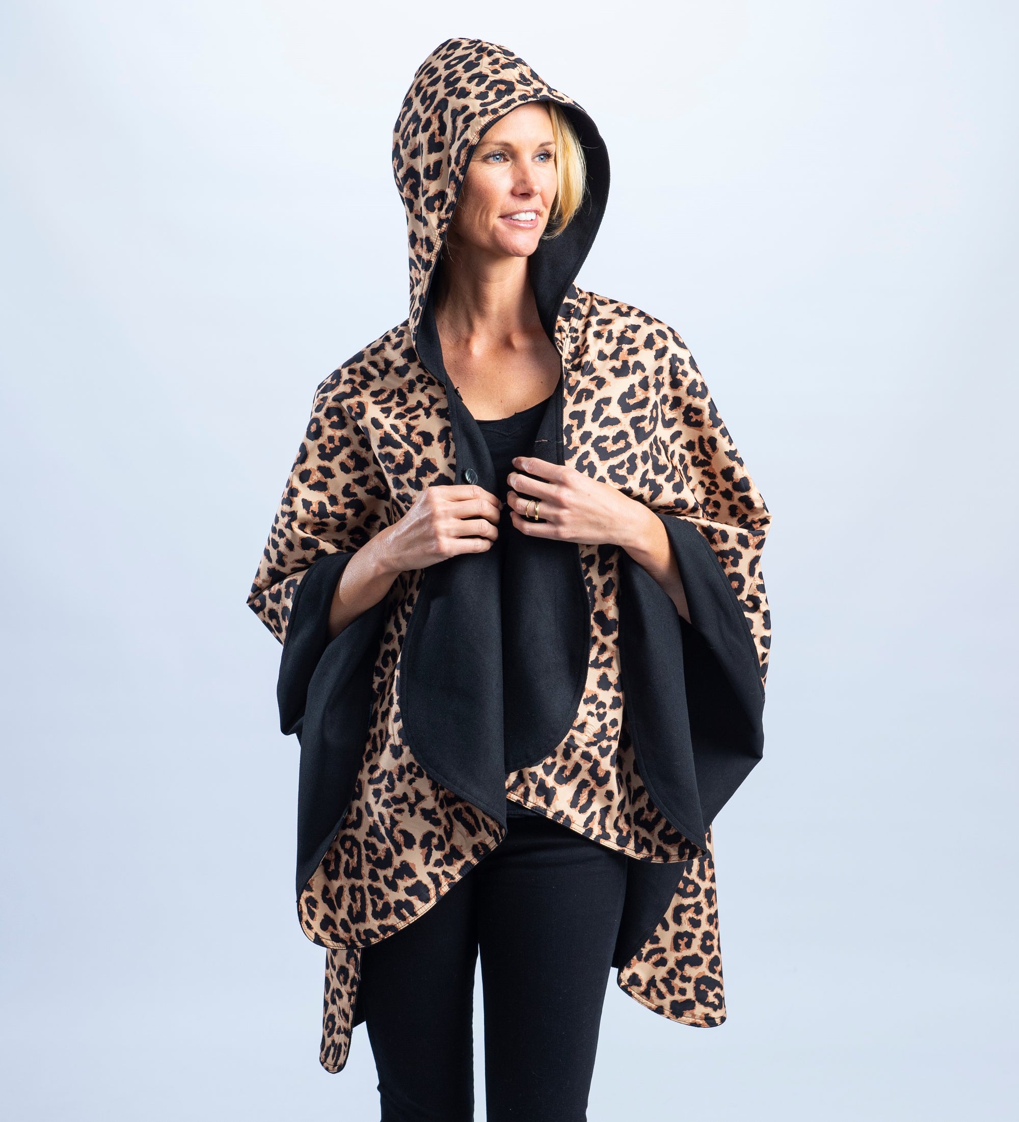 Woman wearing a black & leopard print cheetah print RainCaper