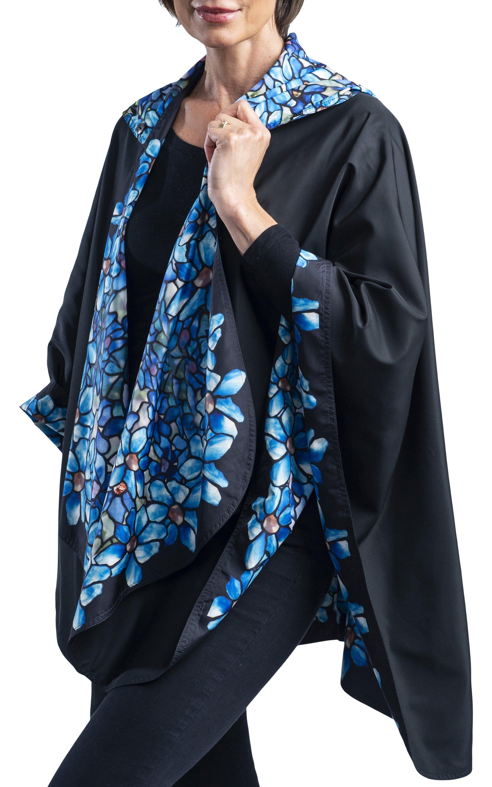 Woman wearing a RainCaper Tiffany Clematis Travel Cape.