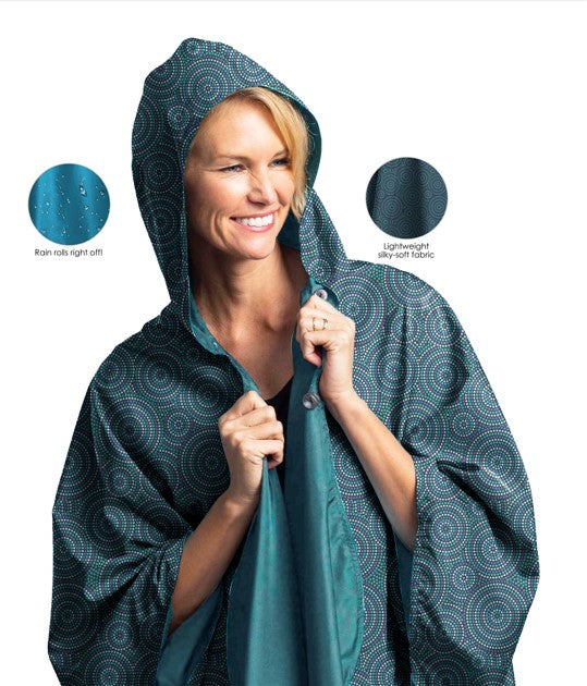 Women wearing a Soft Teal & Circle Dots Reversible RainCaper travel cape