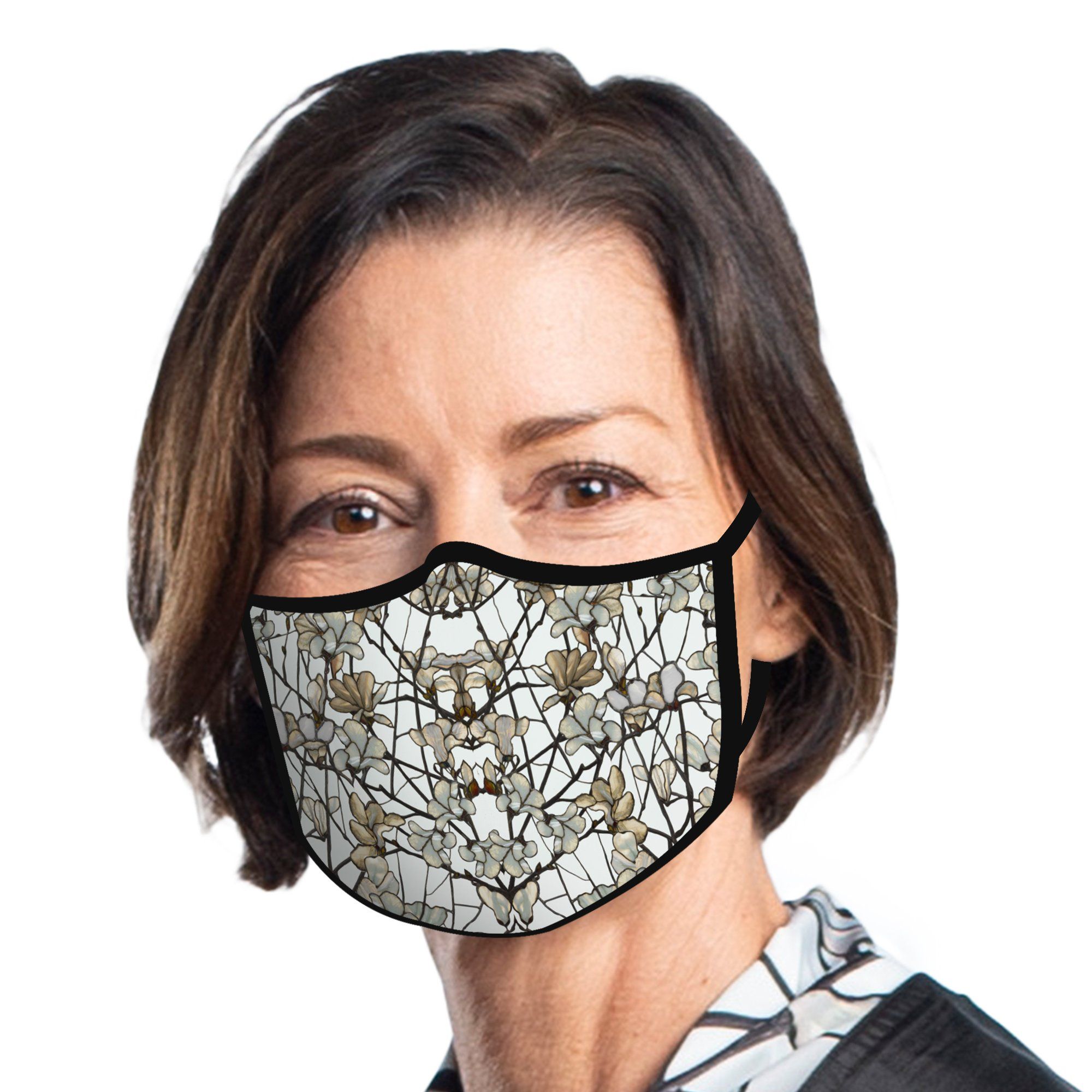 Woman wearing a RainCaper Tiffany Magnolia Reusable Fabric Face Mask.