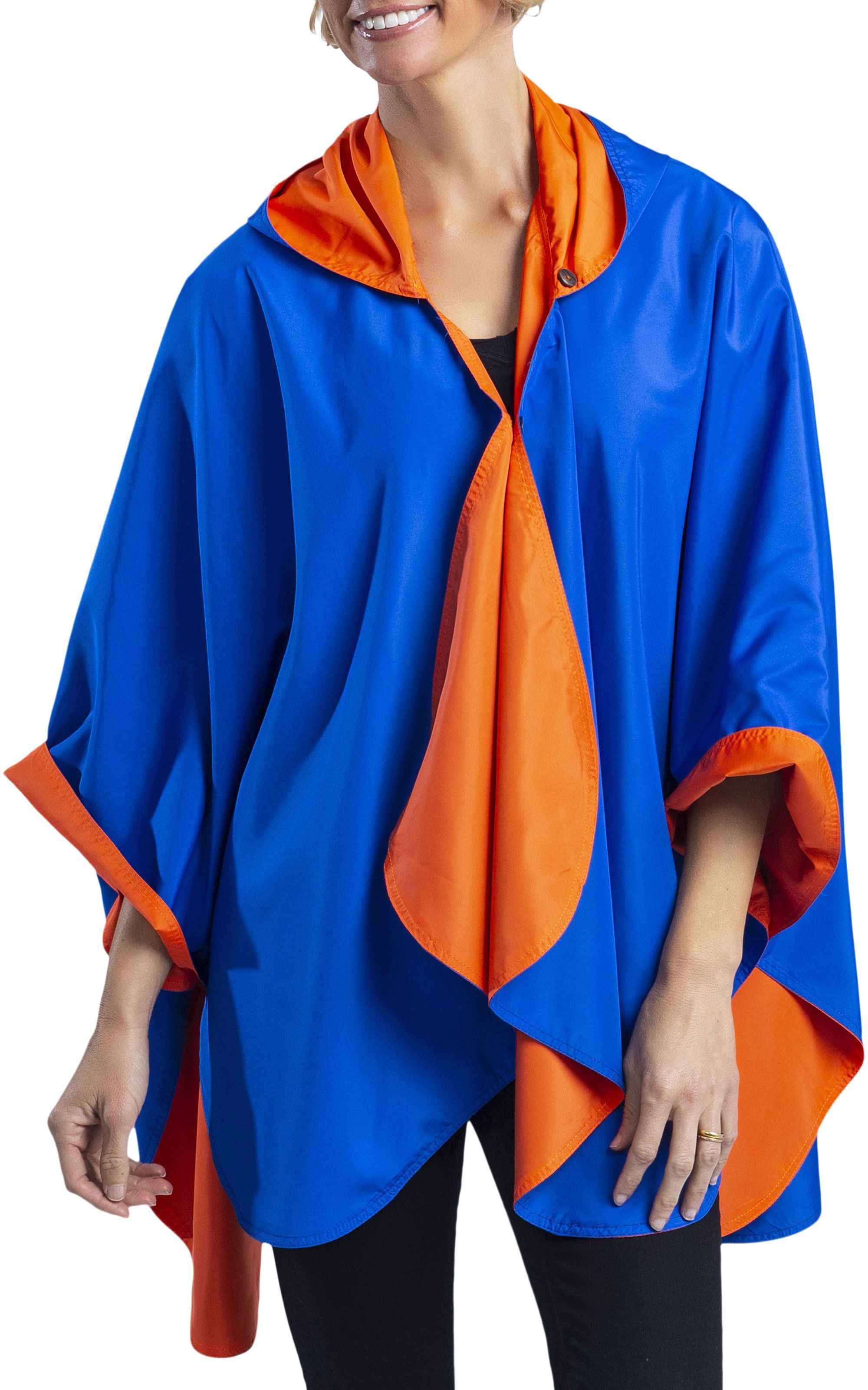  Woman wearing a Royal Blue & Orange Wind & Rainproof Cheer Cape with the Royal Blue side out, revealing the Orange print at the lapels,neckline and cuffs